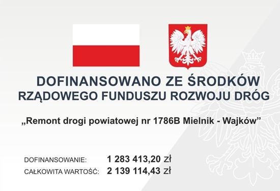 Baner z flagą Polski, herbem i tekstem dotyczącym lokalnego projektu inwestycyjnego. Tekst transkrypcji: DOFINANSOWANO ZE ŚRODKÓW RZĄDOWEGO FUNDUSZU ROZWOJU DRÓG „Remont drogi powiatowej nr 1786B Mielnik – Wajków” DOFINANSOWANIE: 1 283 413,20 zł CAŁKOWITA WARTOŚĆ: 2 139 114,43 zł