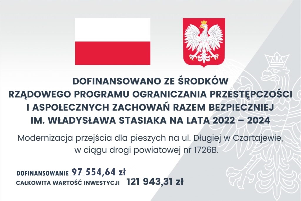 Baner z flagą Polski, herbem i tekstem dotyczącym rządowego programu modernizacji ścieżek dla pieszych. Transkrypcja tekstu: DOFINANSOWANO ZE ŚRODKÓW RZĄDOWEGO PROGRAMU OGRANICZANIA PRZESTĘPCZOŚCI I ASPOŁECZNYCH ZACHOWAŃ RAZEM BEZPIECZNIEJ IM. WŁADYSŁAWA STASIAKA NA LATA 2022 – 2024