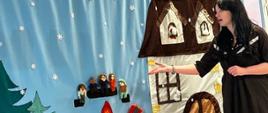 Aktorka przy dekoracji scenicznej przedstawiającej zimowy krajobraz - dom, ognisko i siedzące wokół dzieci