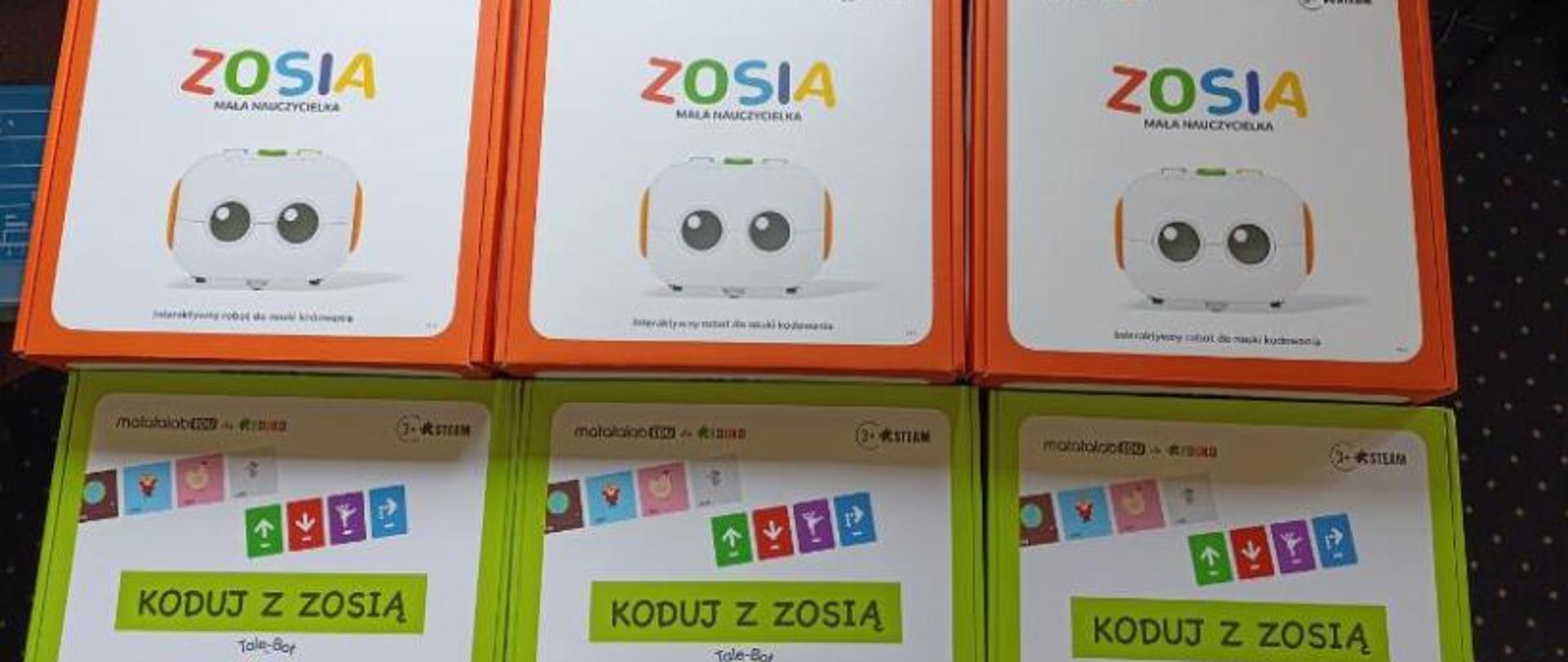 sprzęt zakupiony z programu „Małopolska Ścieżka Rozwoju Nauczycieli Wychowania Przedszkolnego”. Robot Zosia sześć sztuk w pudełkach poukładane jeden obok drugiego.