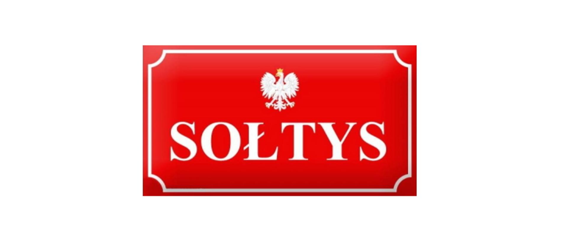 Czerwona tabliczka z białym orłem w koronie i napisem Sołtys