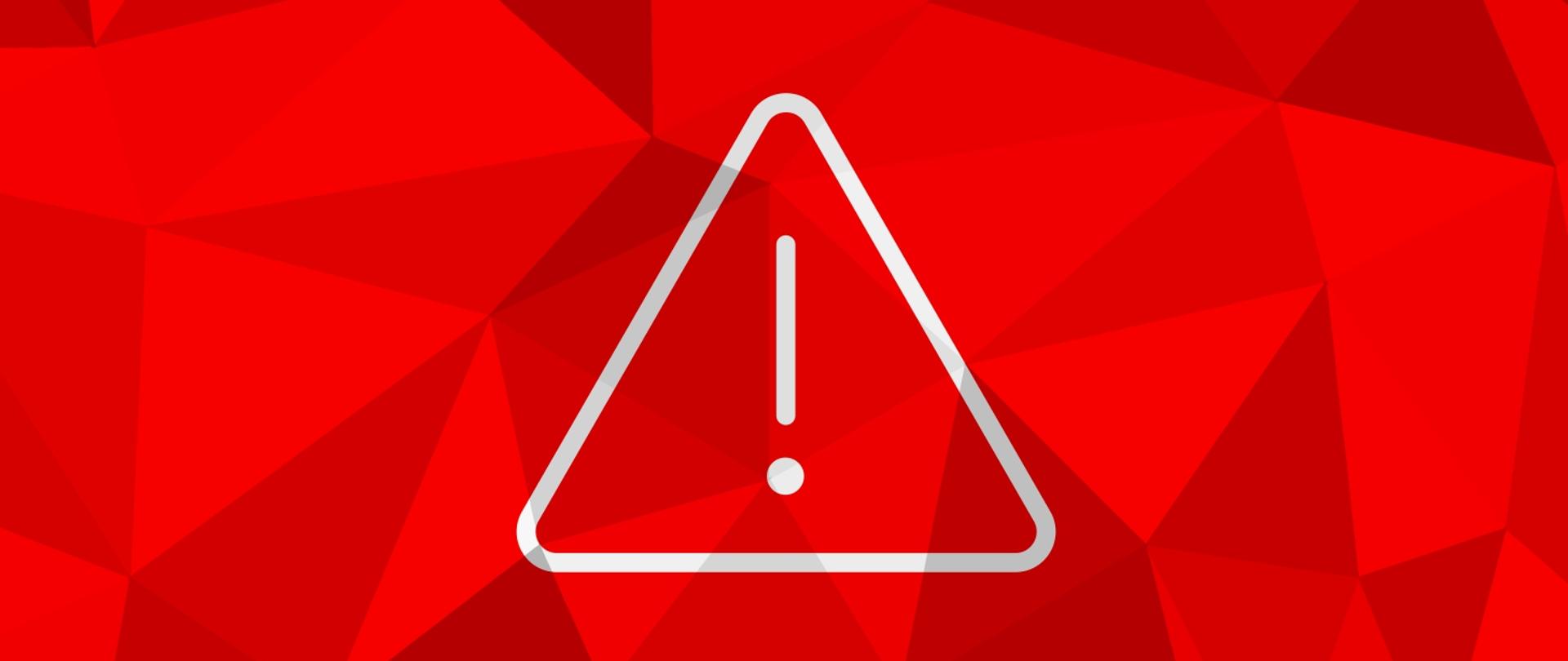 Grafika przedstawia białą ikonę wykrzyknika w trójkącie na tle złożonym z trójkątów w odcieniach koloru czerwonego.
