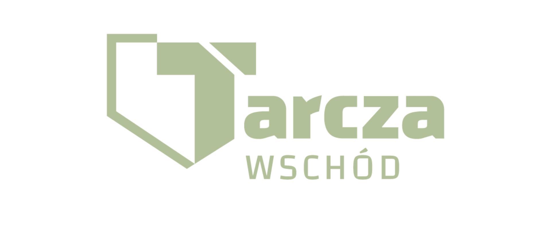 Na białym tle zielony napis Tarcza Wschód 