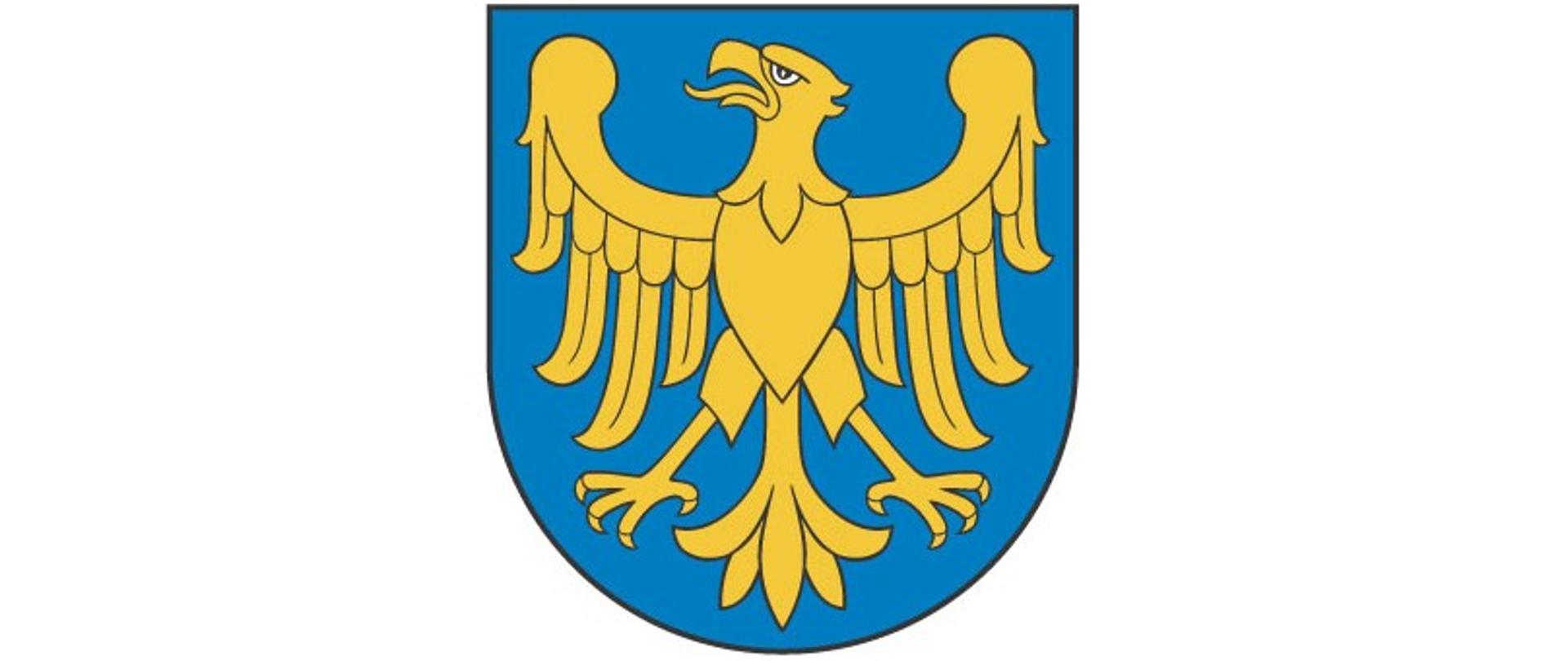 Złoty orzeł Piastów górnośląskich bez korony, zwrócony w prawo, na niebieskim tle