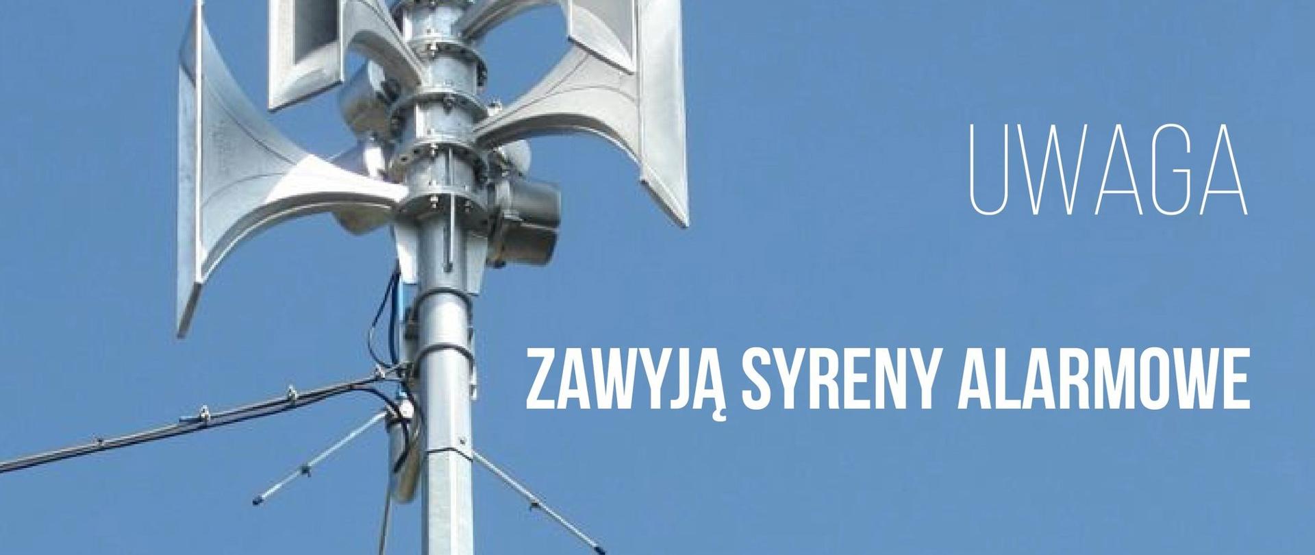 Uwaga zawyją syreny alarmowe. Zdjęcie syren alarmowych na niebieskim tle.