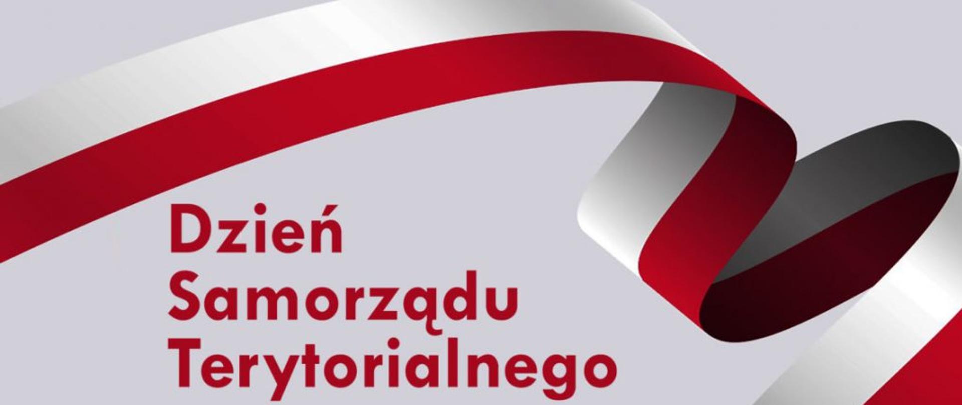 Na zdjęciu widać wstęgę biało-czerwoną oraz napis Dzień Samorządu Terytorialnego